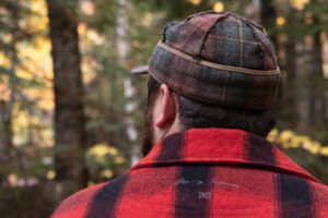 Matthew Smart models the Original Stormy Kromer Cap and the Mackinac Coat.