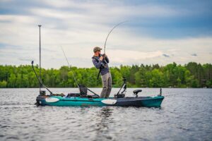 McKeon Roberts (@mckeonhugh @wired2fish) catches a huge fish while sporting his Stormy Kromer cap.