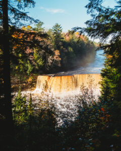 Fall trees surround Tahquamenon Falls.