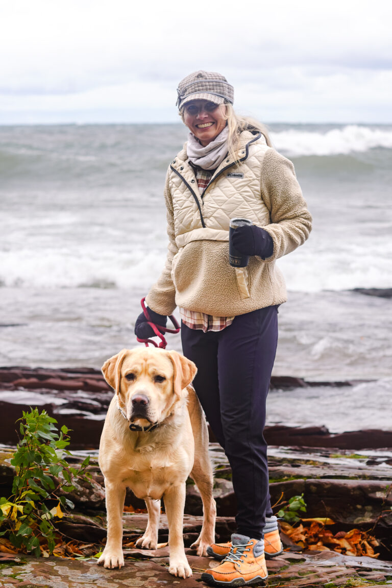 withheidijoy wearing a Stormy Kromer Cap standing net to the water