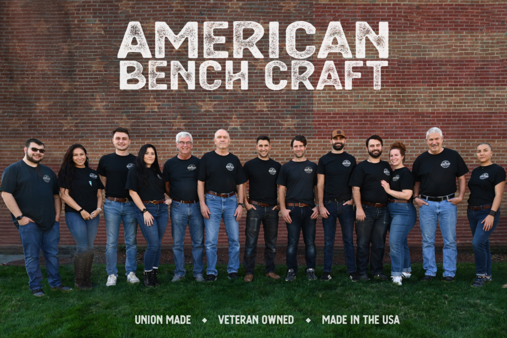 The American Bench Craft team poses next to text reading, "American Bench Craft: Union Made, Veteran Owned, Made in the USA."